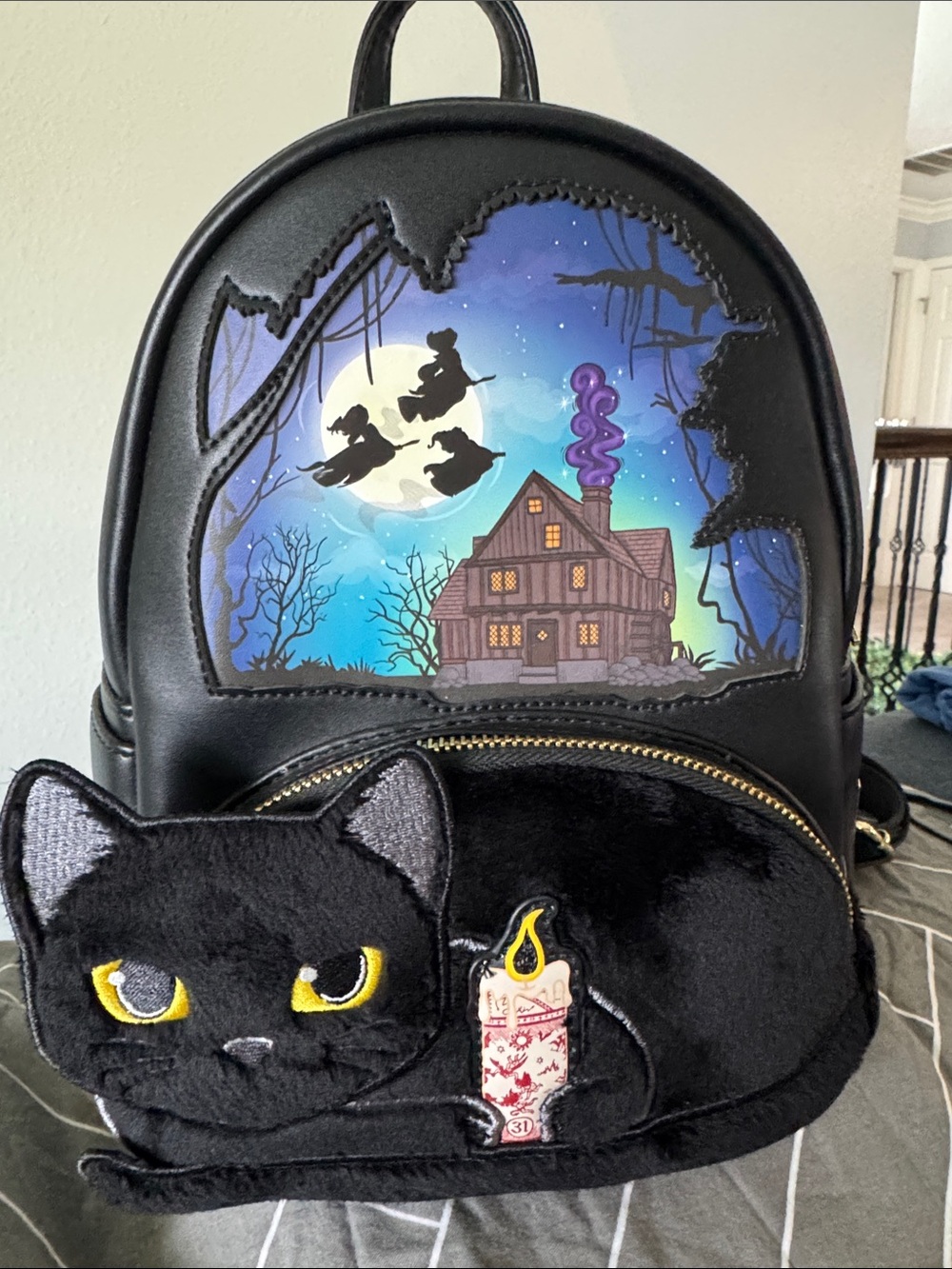 Plush Black Cat Backpack with Haunted Night Artwork